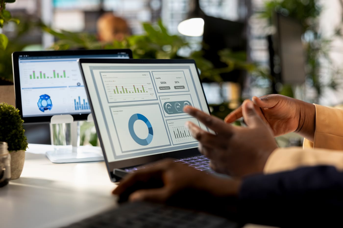 Analytics dashboard with charts on a laptop, illustrating centralized visibility and control over software spend